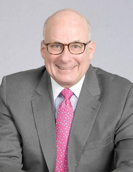Dennis Unkovic in a gray suit and pink tie