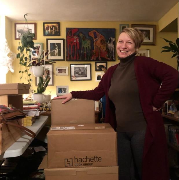 Helen with boxes of books
